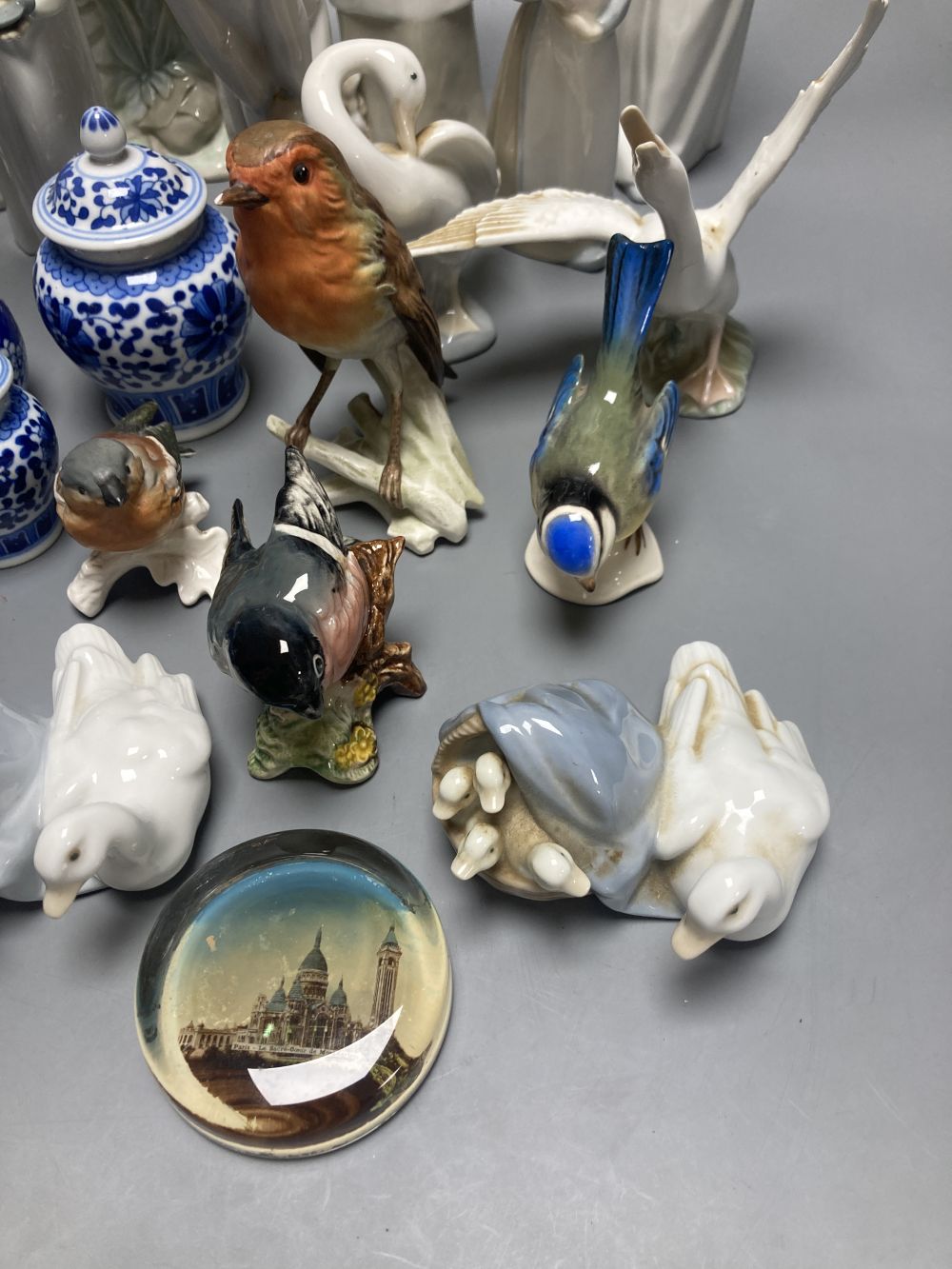 A collection of Lladro and Goebel porcelain figures and other items